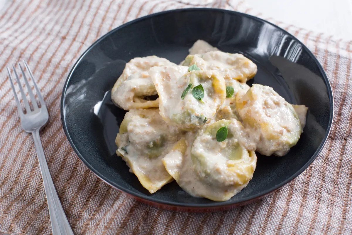Pansoti - A stuffed pasta filled with wild herbs and ricotta, served with a creamy walnut sauce