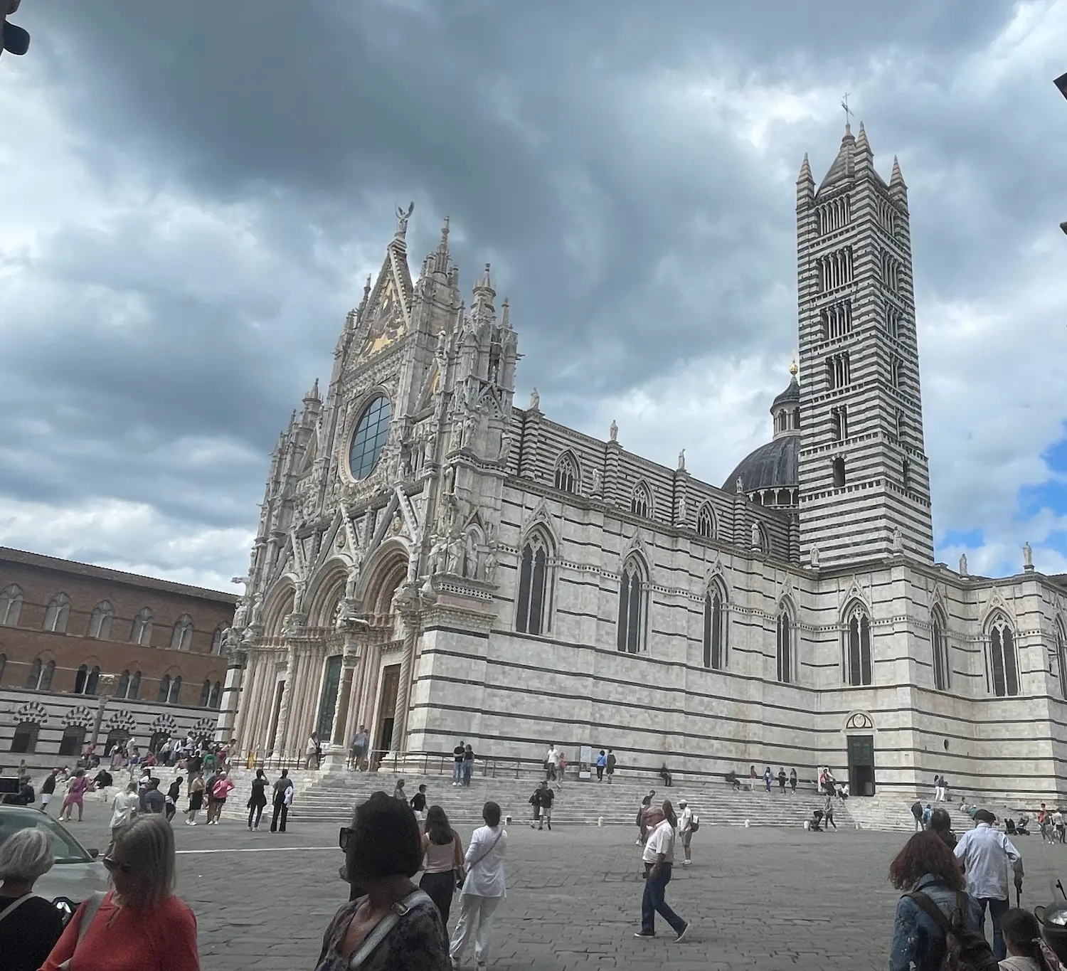 The interior of the Duomo di Siena — banded marble columns rising to the vaulted ceiling