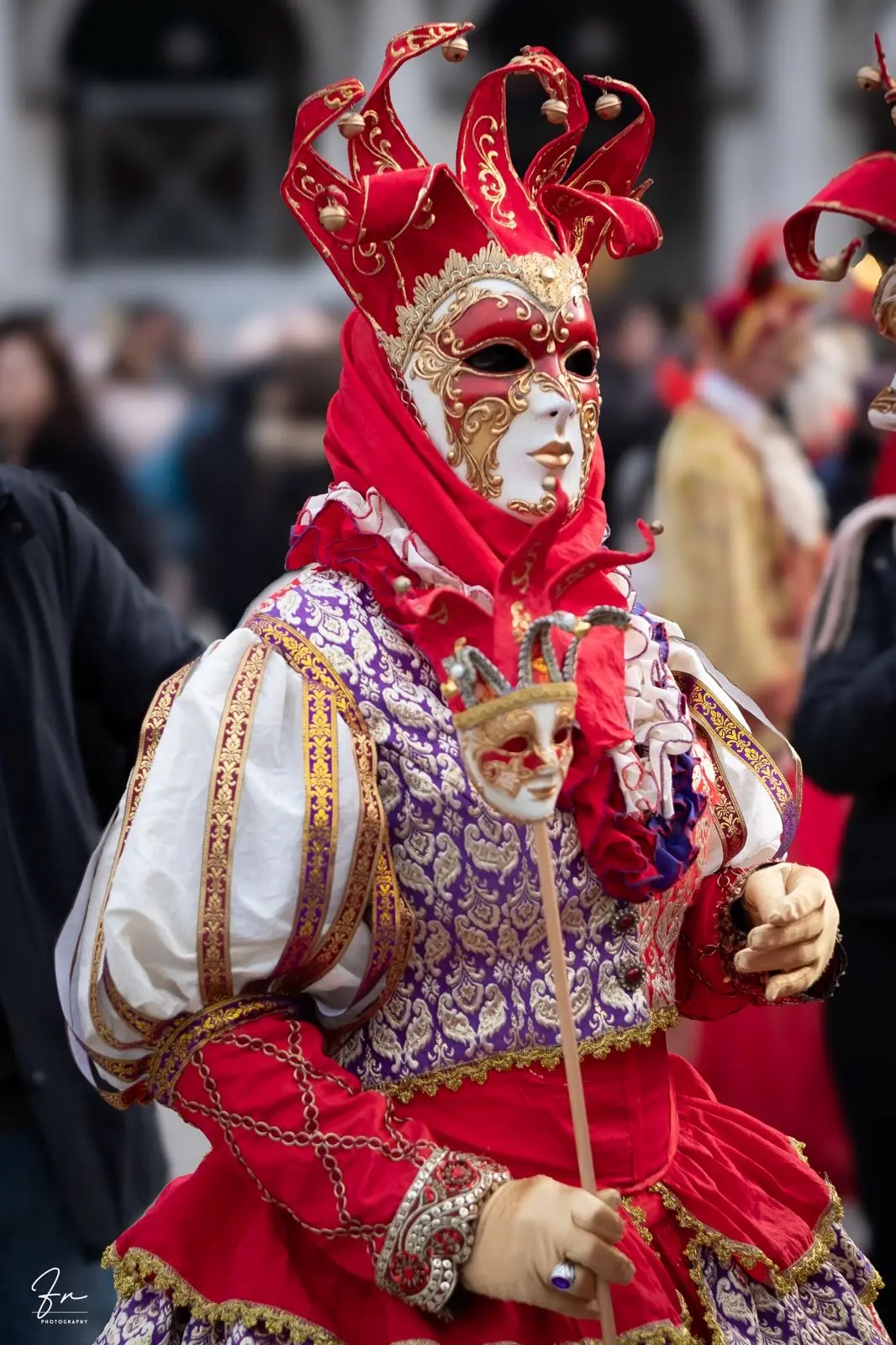 Jester-style Carnival mask and headdress with bells, red and gold costume, Venice