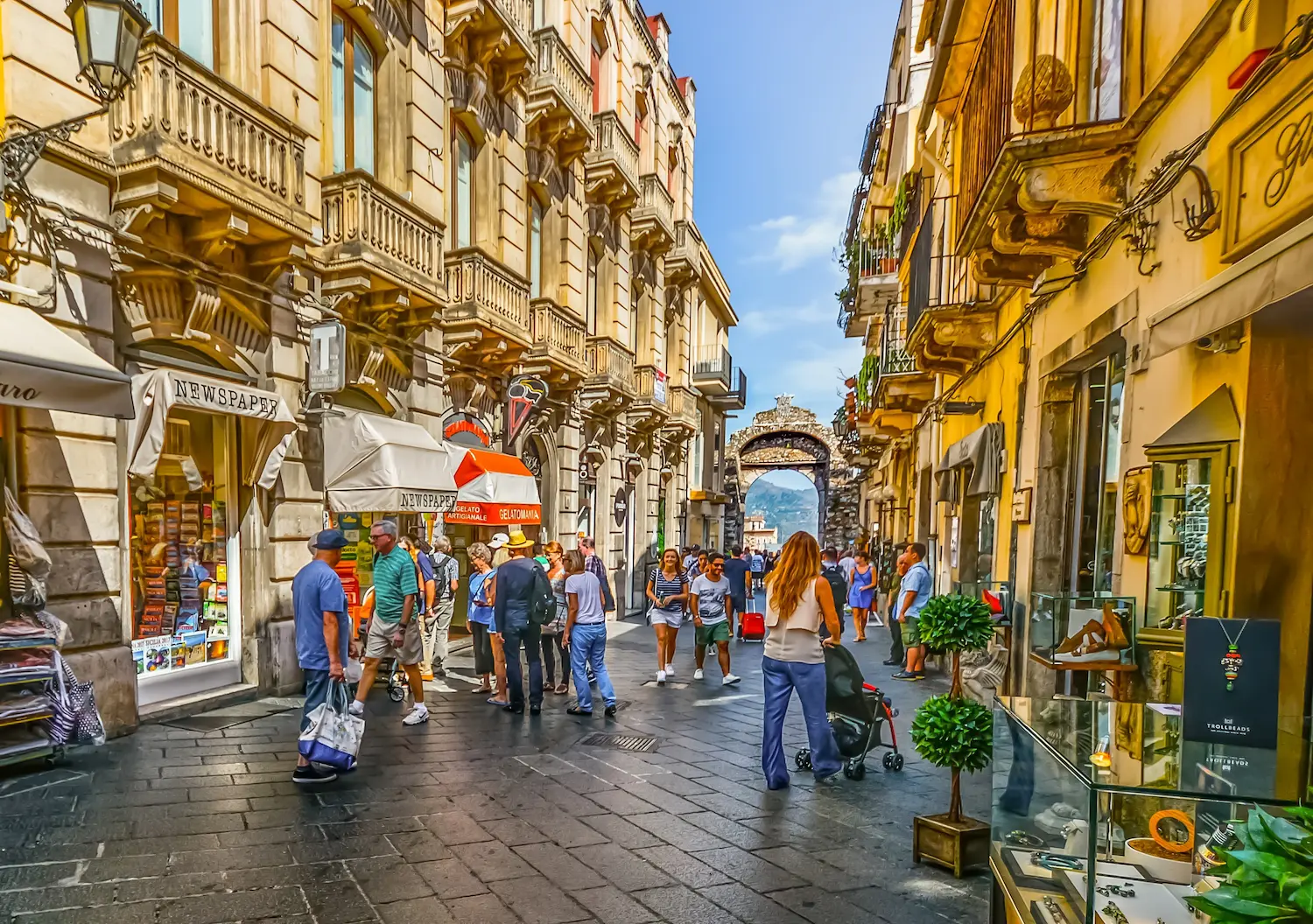 Corso Umberto, the main street of Taormina, lined with shops, cafes and historical buildings